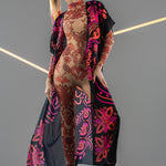 Front view of DUAL NEON VIBES Tattoo Catsuit with chiffon kimono overlay – combining neon pink and orange patterns with a layered look.