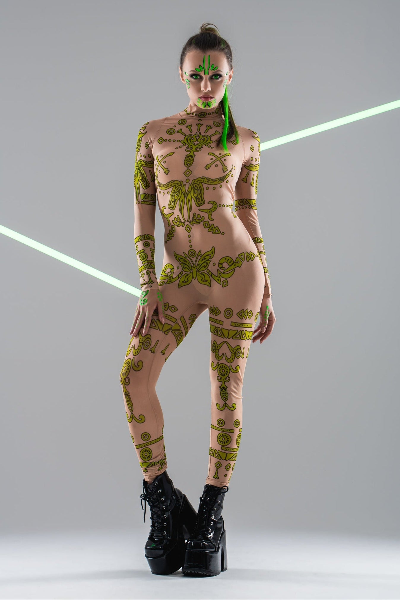 Front view of GREEN TRIBAL Tattoo Catsuit – UV Reactive – worn alone, showcasing the tribal tattoo design.