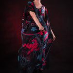Woman wearing the Oriental Blossom Kimono, featuring vibrant floral accents, perfect for themed events, festivals, or stylish everyday wear.