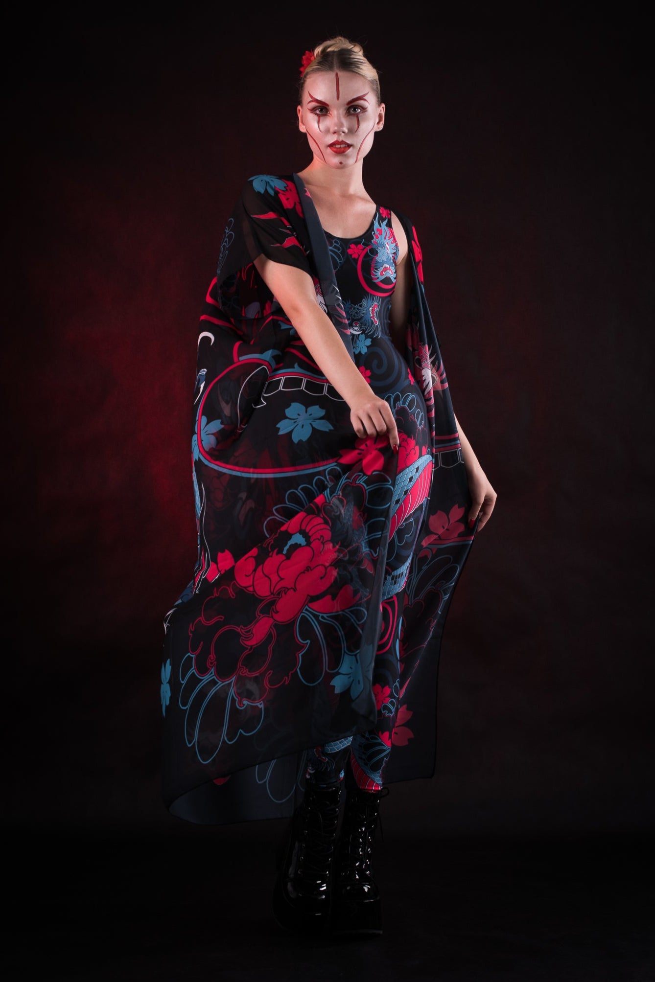Woman wearing the Oriental Blossom Kimono, featuring vibrant floral accents, perfect for themed events, festivals, or stylish everyday wear.