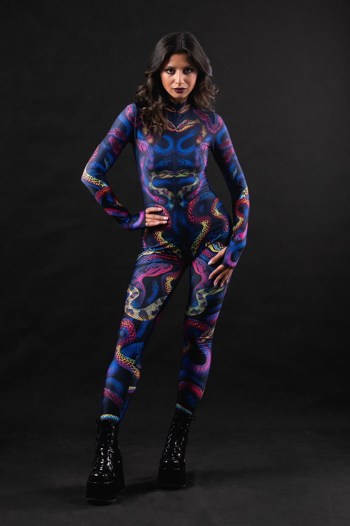 Woman posing in the Snakes & Shades costume, highlighting the bold snake print and colorful design, great for Halloween or as a unique festival outfit.