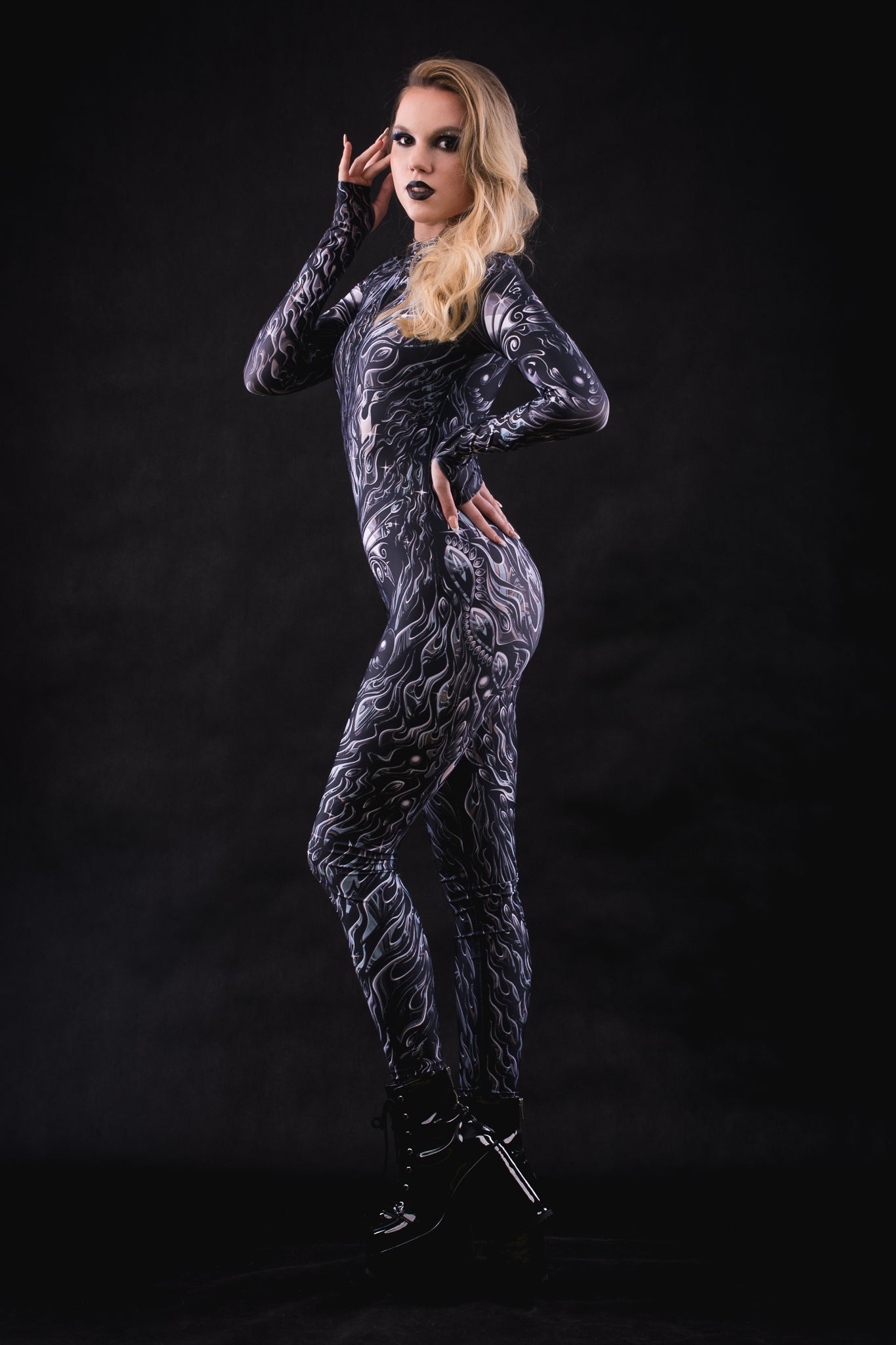 Woman posing in the Nocturnal Butterfly Halloween costume, highlighting the dark butterfly wing design, perfect for Halloween parties, festivals, or as a unique statement outfit.