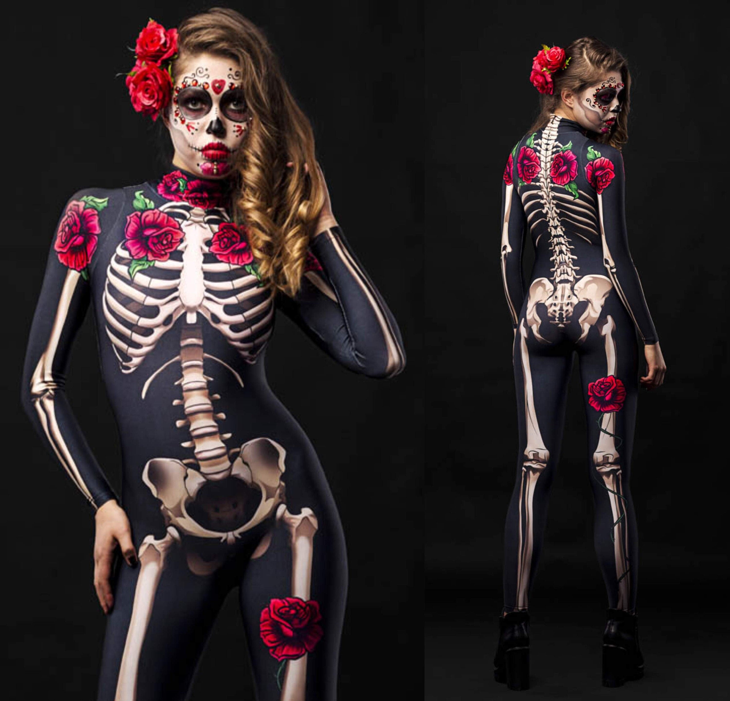Women wearing a skeleton bodysuit with red rose accents and matching floral cloak, styled for Halloween. The outfit is inspired by Day of the Dead with intricate sugar skull face makeup and a crown of red roses.