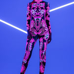 Front view of the Neon Flowers UV Reactive Catsuit glowing under blacklight – vibrant floral print with full-body neon effect for standout rave looks.