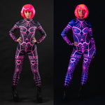 Woman wearing the Pink Neon Spiderweb UV Reactive costume, a full-body suit with glowing spiderweb accents, perfect for Halloween or festival events.