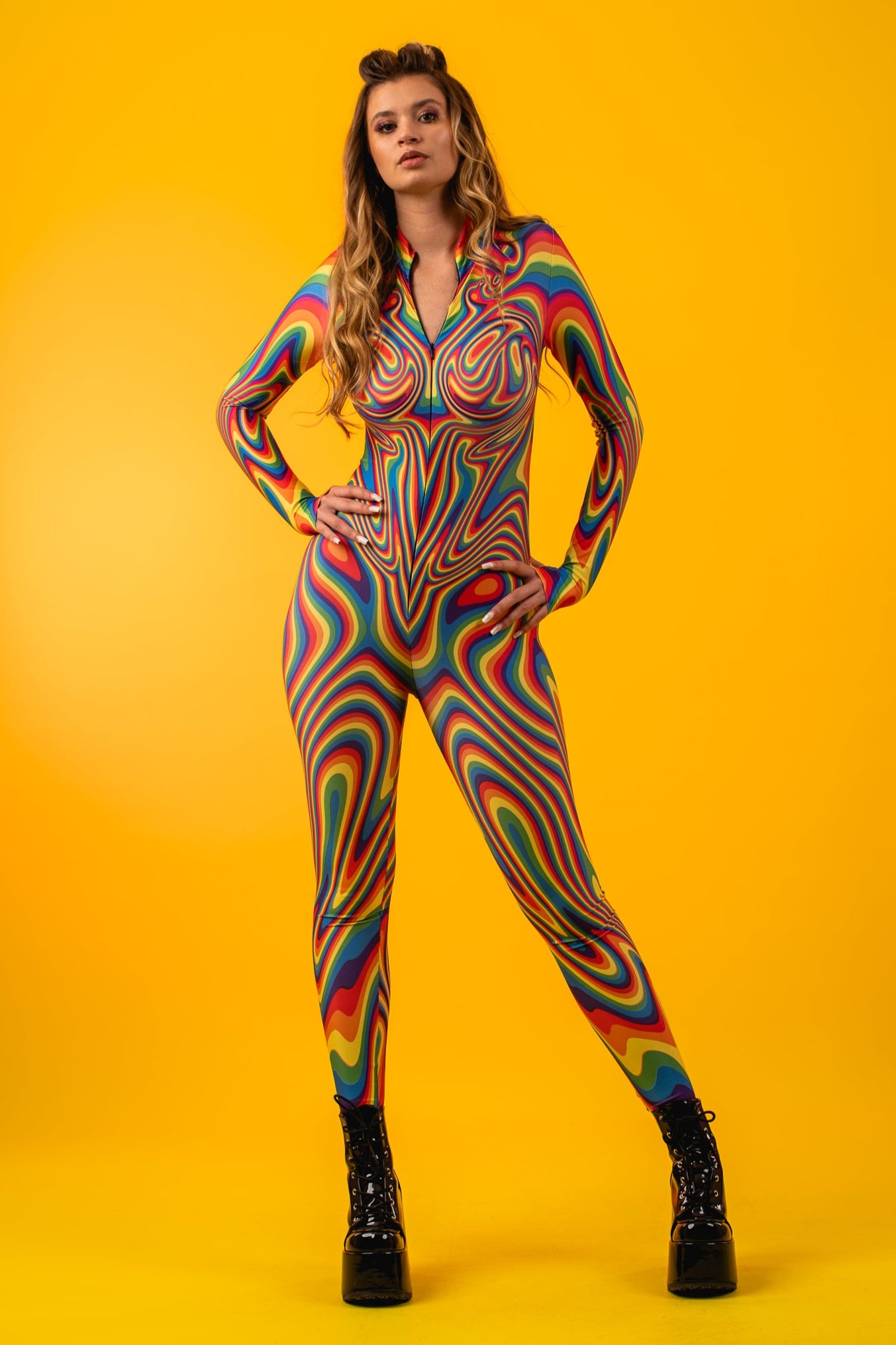 Model stands proudly in Rainbow Liquid Catsuit, embodying self-love, LGBTQ+ pride, and fierce festival energy.