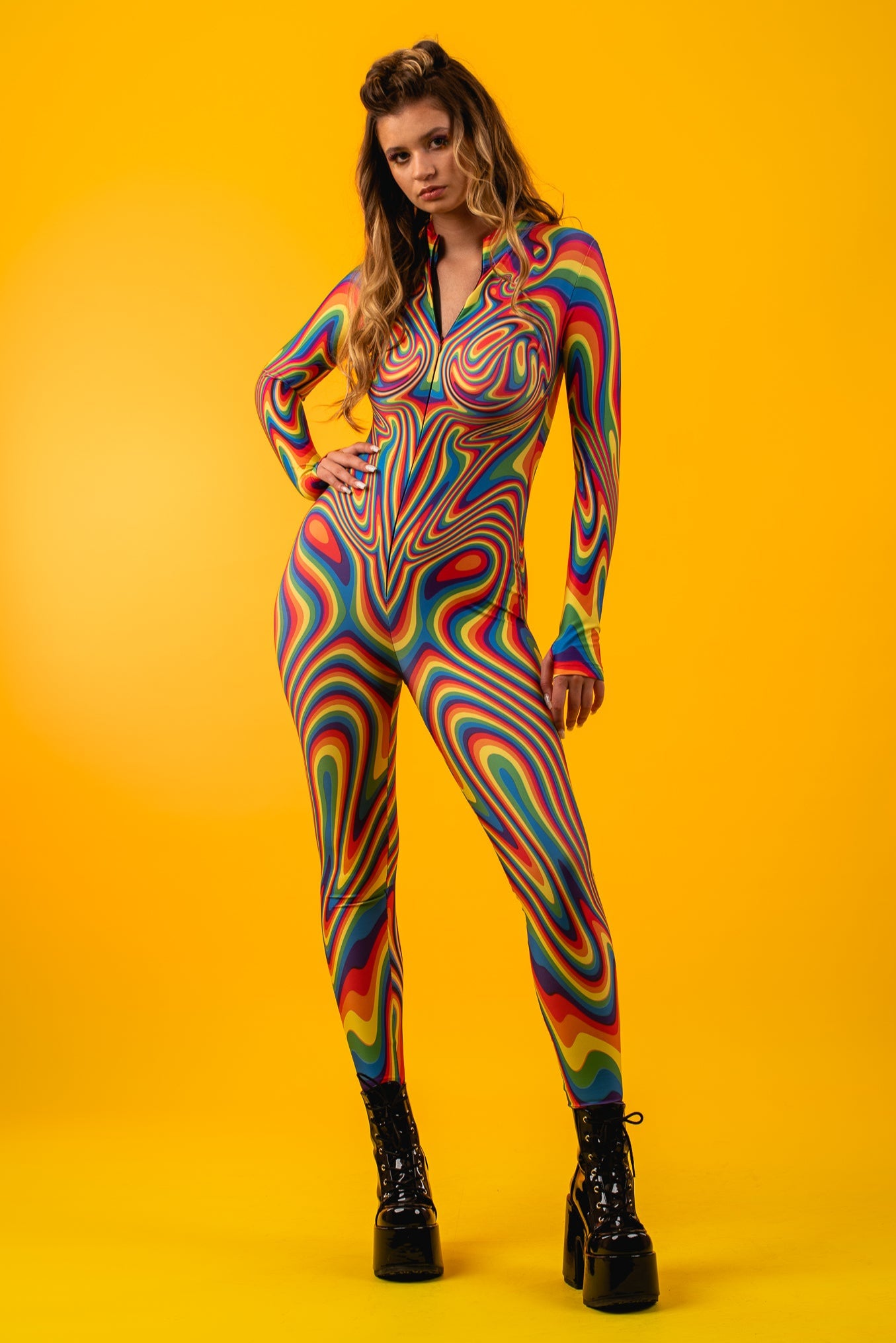Front view of Rainbow Liquid Catsuit, showcasing vibrant rainbow print and sleek silhouette perfect for Pride and LGBTQ+ events.