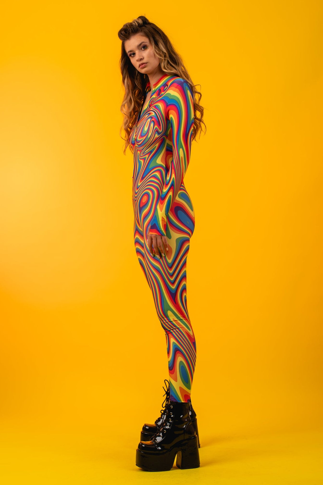 Side view of Rainbow Liquid Catsuit, emphasizing curve-hugging fit and vibrant colors ideal for Pride marches and dance parties.