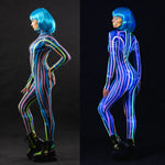 Woman posing in the Space Lines UV Reactive costume, highlighting the neon space line design that lights up under UV light, ideal for raves, Halloween, or as a unique festival outfit.
