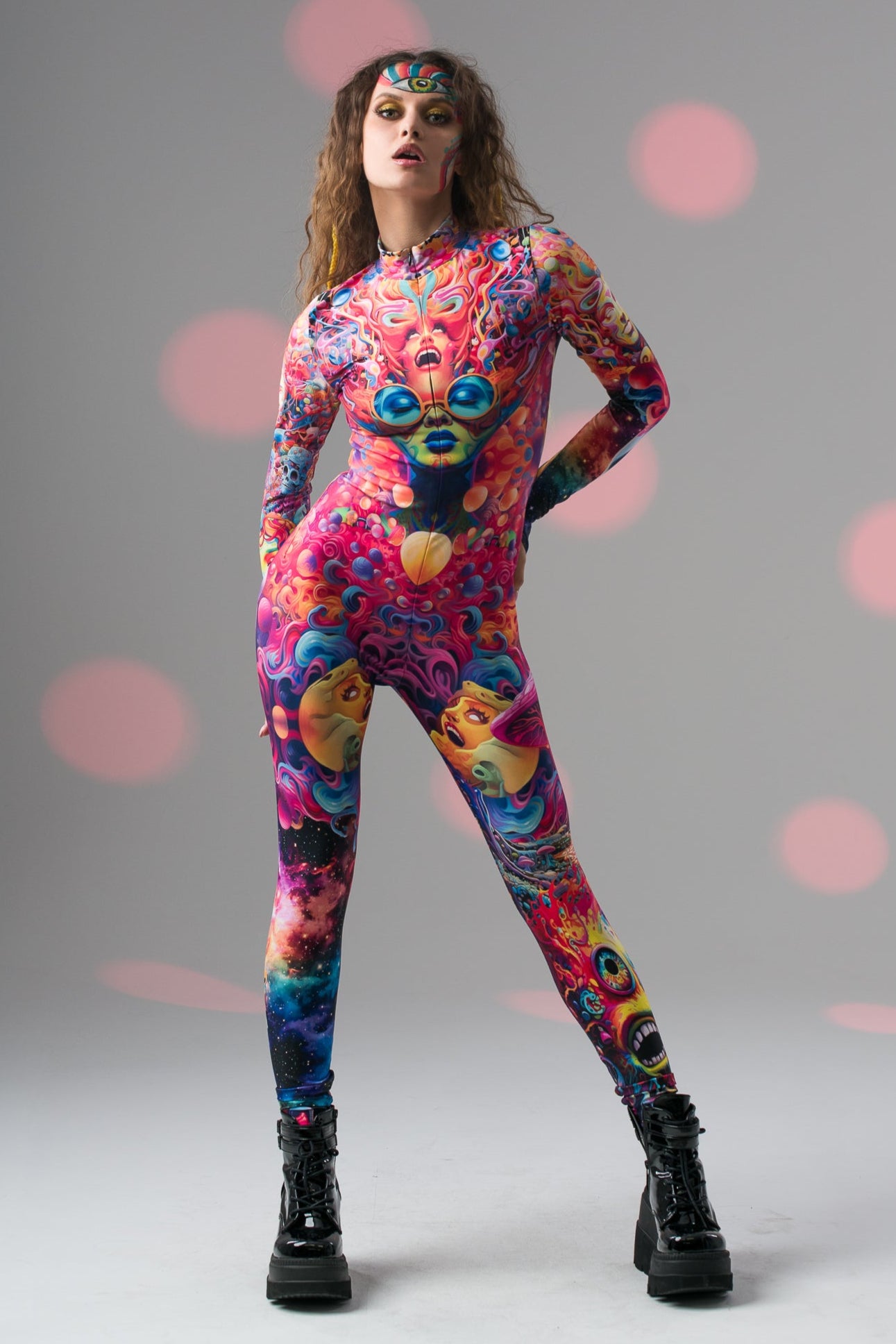 Model in TRIPPY DREAM Catsuit strikes a proud dynamic front pose, highlighting striking psychedelic design and confident style.