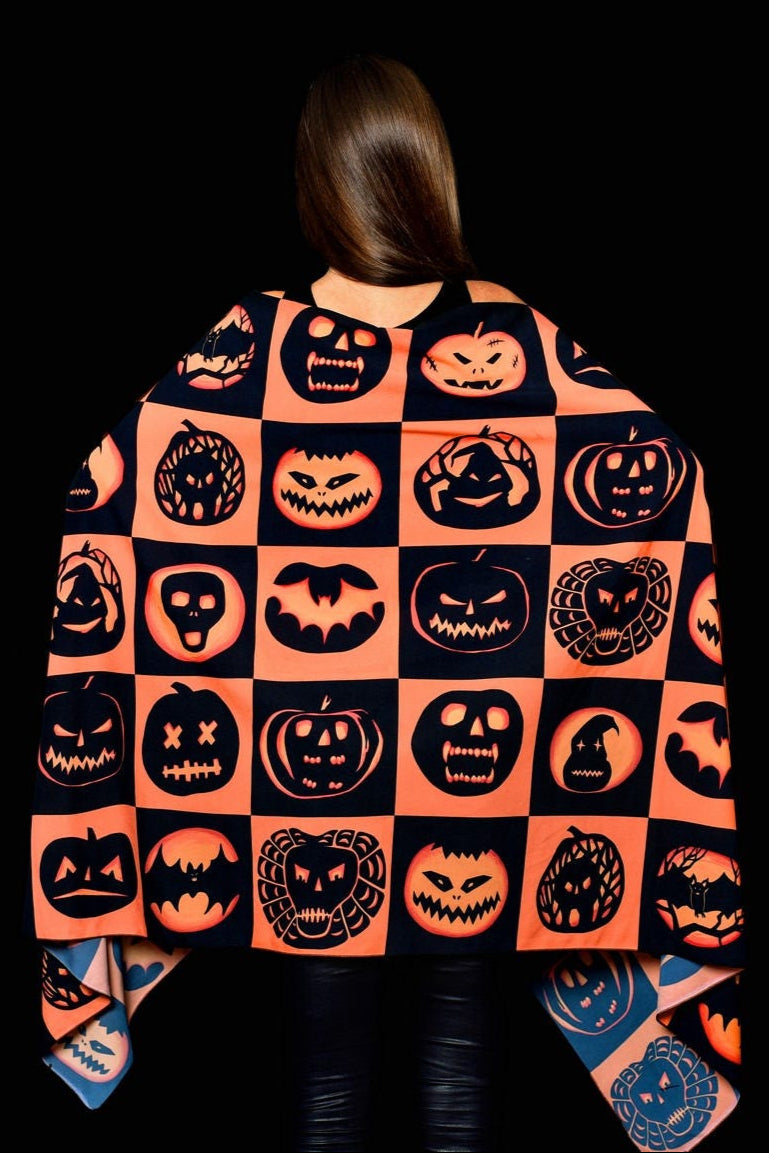 Close-up of the pumpkin, bat, and skull print on the Halloween scarf, adding a spooky yet stylish touch for Halloween outfits.
