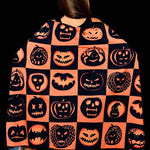 Close-up of the pumpkin, bat, and skull print on the Halloween scarf, adding a spooky yet stylish touch for Halloween outfits.