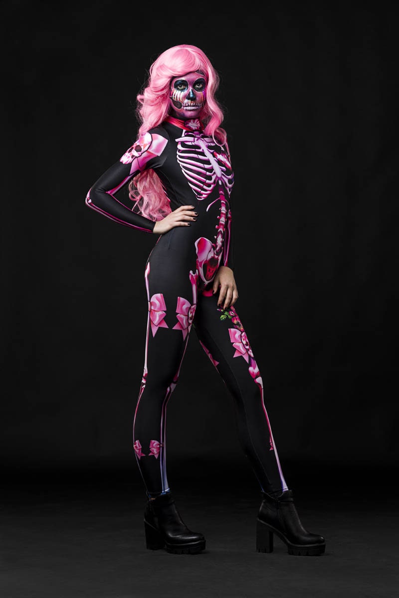 Pink Sugar Skull Skeleton Halloween costume for women, featuring a pastel pink skeleton catsuit with sugar skull details, perfect for Halloween or Day of the Dead celebrations.