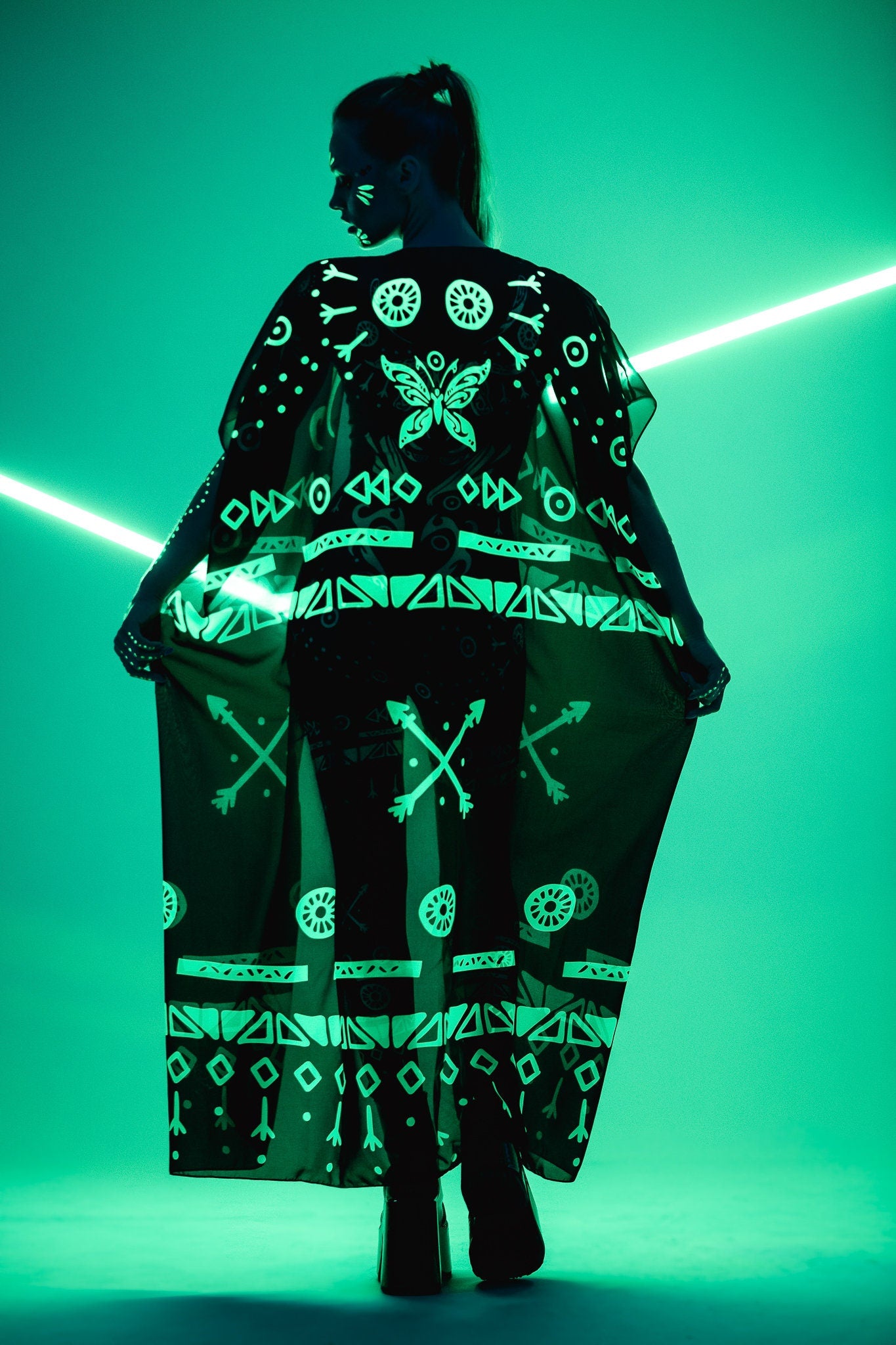 Back view of chiffon kimono over GREEN TRIBAL Tattoo Catsuit – glowing under UV light – mystical and dynamic.
