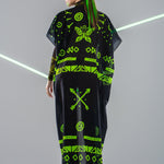 Back view of mesh kimono over GREEN TRIBAL Tattoo Catsuit – natural light – flowy and elegant.