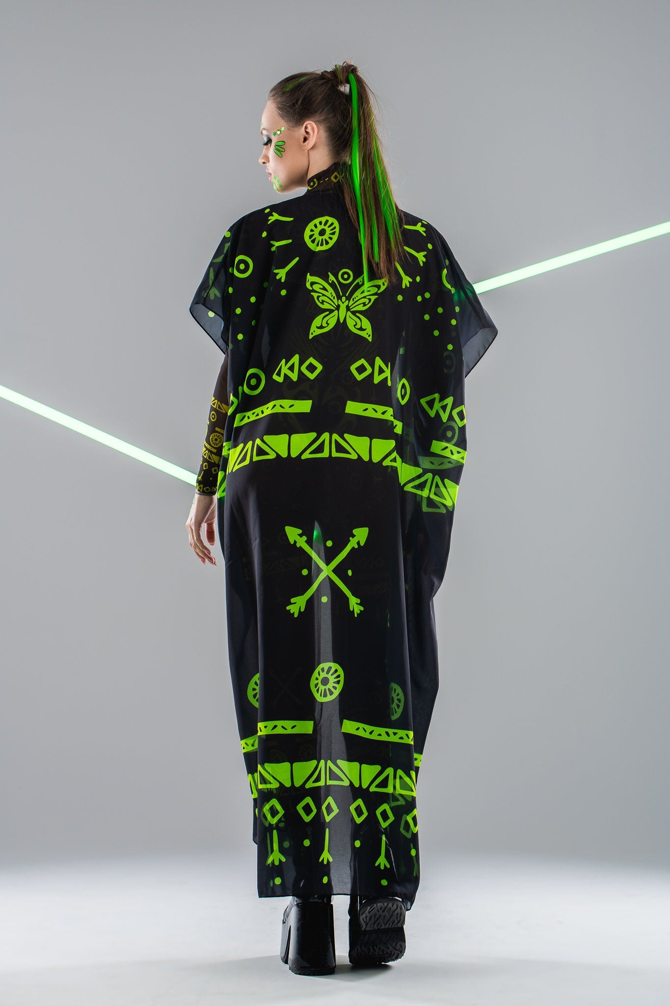 Back view of mesh kimono over GREEN TRIBAL Tattoo Catsuit – natural light – flowy and elegant.