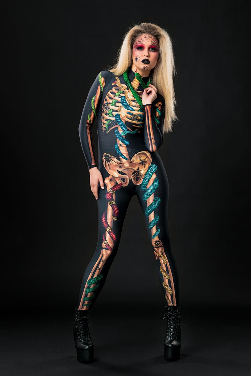 Woman posing in the Snakes & Spiders Skeleton Halloween costume, highlighting the intricate snake, spider, and skeleton details, great for Halloween parties or as a standout festival outfit.
