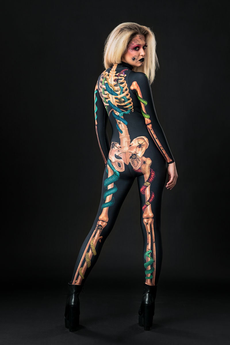 Woman posing in the Snakes & Spiders Skeleton Halloween costume, highlighting the intricate snake, spider, and skeleton details, great for Halloween parties or as a standout festival outfit.