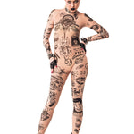 Front view of REBEL TATTOOS (black) Tattoo Catsuit for Women – model posing confidently with hands on hips, emphasizing the powerful design.