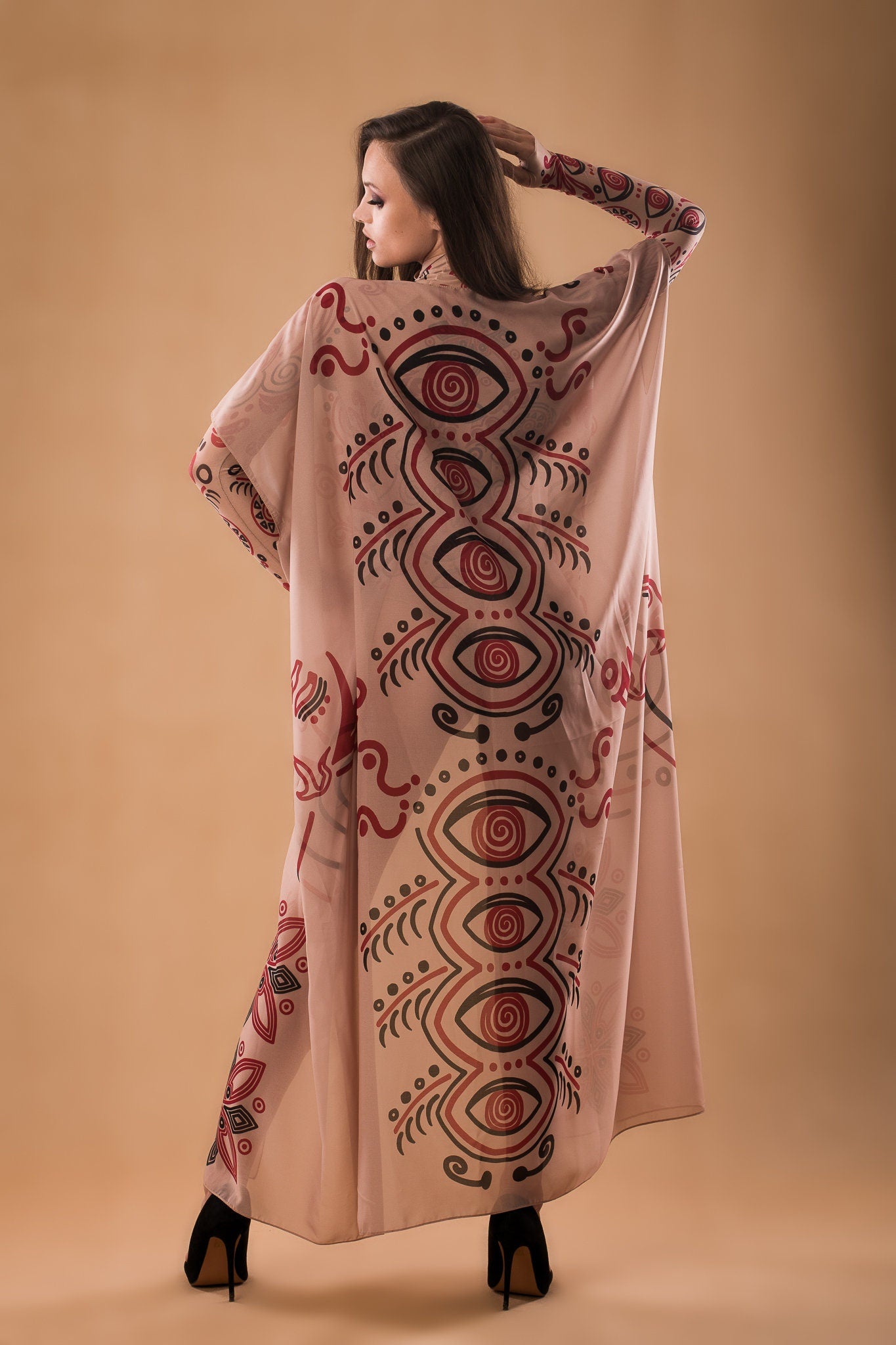 Full back view of SCARLET INK Tattoo Catsuit, complemented by a flowing sleeveless kimono for added style.