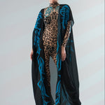 Front view of LEOPARD SPOTS Tattoo Catsuit for Women styled with sleeveless kimono – blending tattoo print with flowing kimono layer.