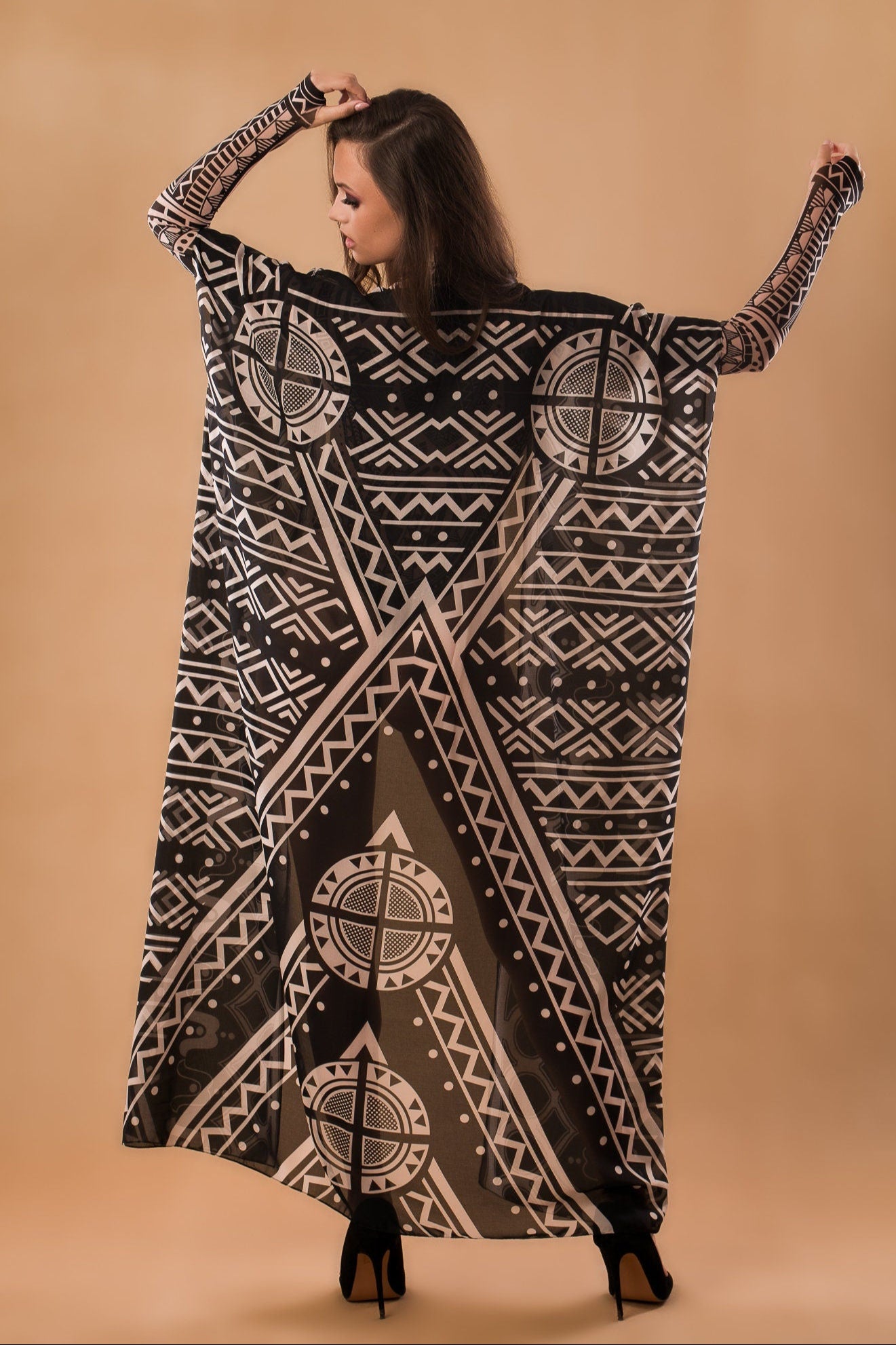 Back view of MAJESTIC TRIBAL Tattoo Catsuit for Women with sleeveless kimono – showcasing the elegant flow and intricate tribal-inspired pattern of the kimono.