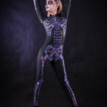 Woman posing in the Flower Skeleton costume, showcasing vibrant purple and blue skeleton design with flowers, ideal for Halloween or as a striking festival outfit.