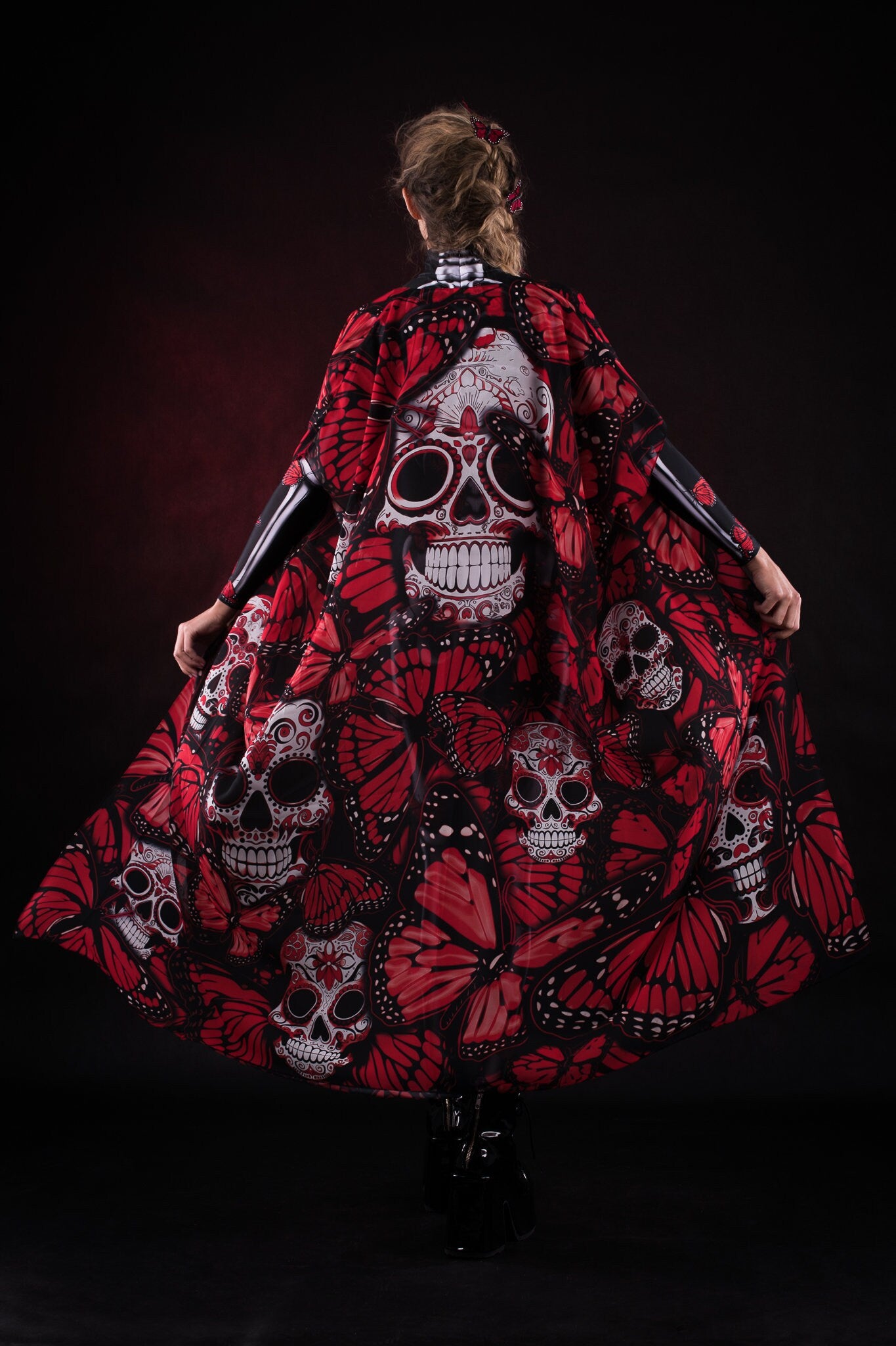 Woman posing in the Lady Red Butterfly skeleton costume, highlighting the vibrant butterfly design, skeleton theme, and flowing kimono, ideal for Halloween or as a striking festival outfit.
