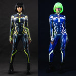 Side-by-side collage of UV and natural light views of the Cyber Tron Catsuit in a relaxed pose – highlighting color transformation.