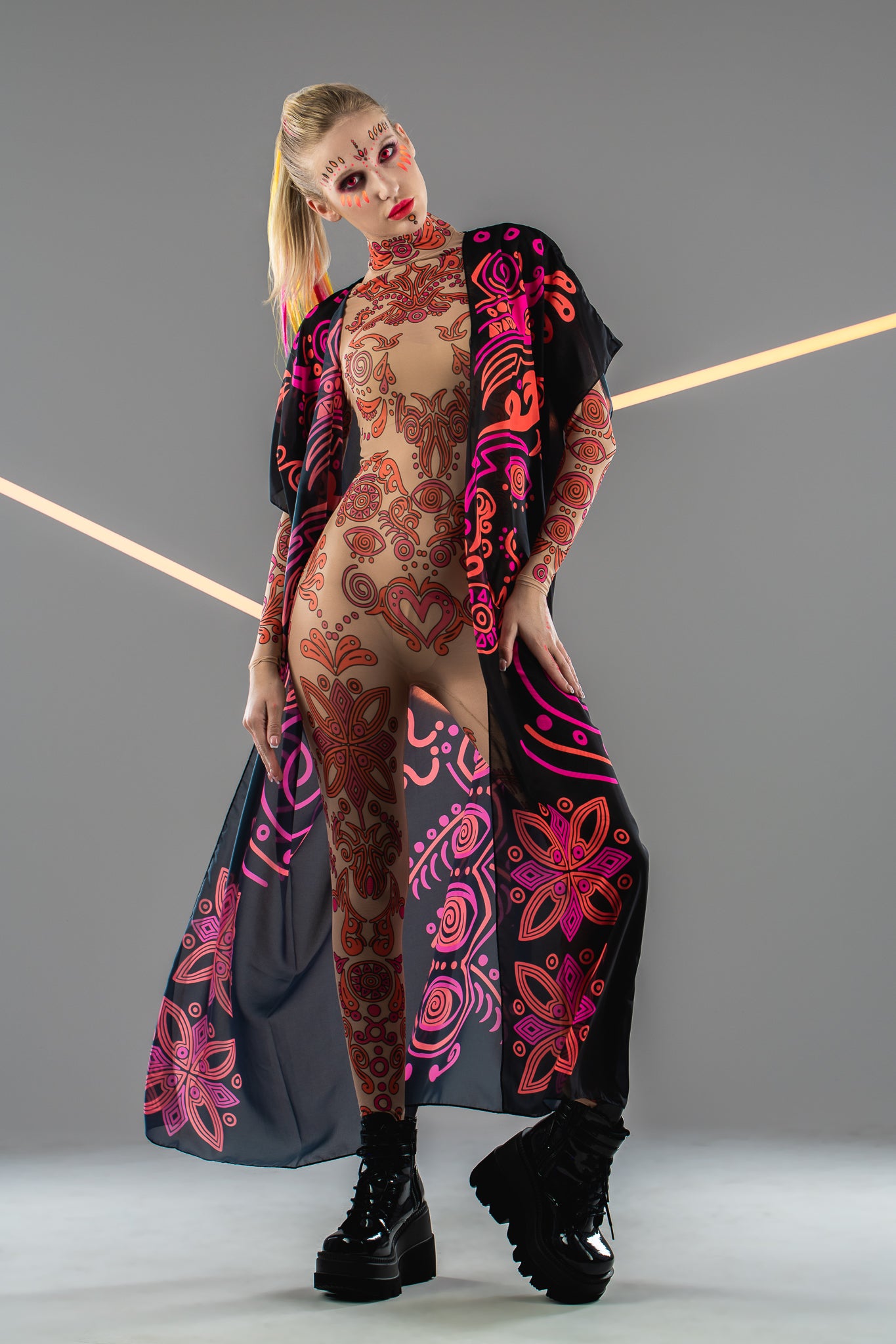 Front view of DUAL NEON VIBES Tattoo Catsuit with chiffon kimono overlay – combining neon pink and orange patterns with a layered look.