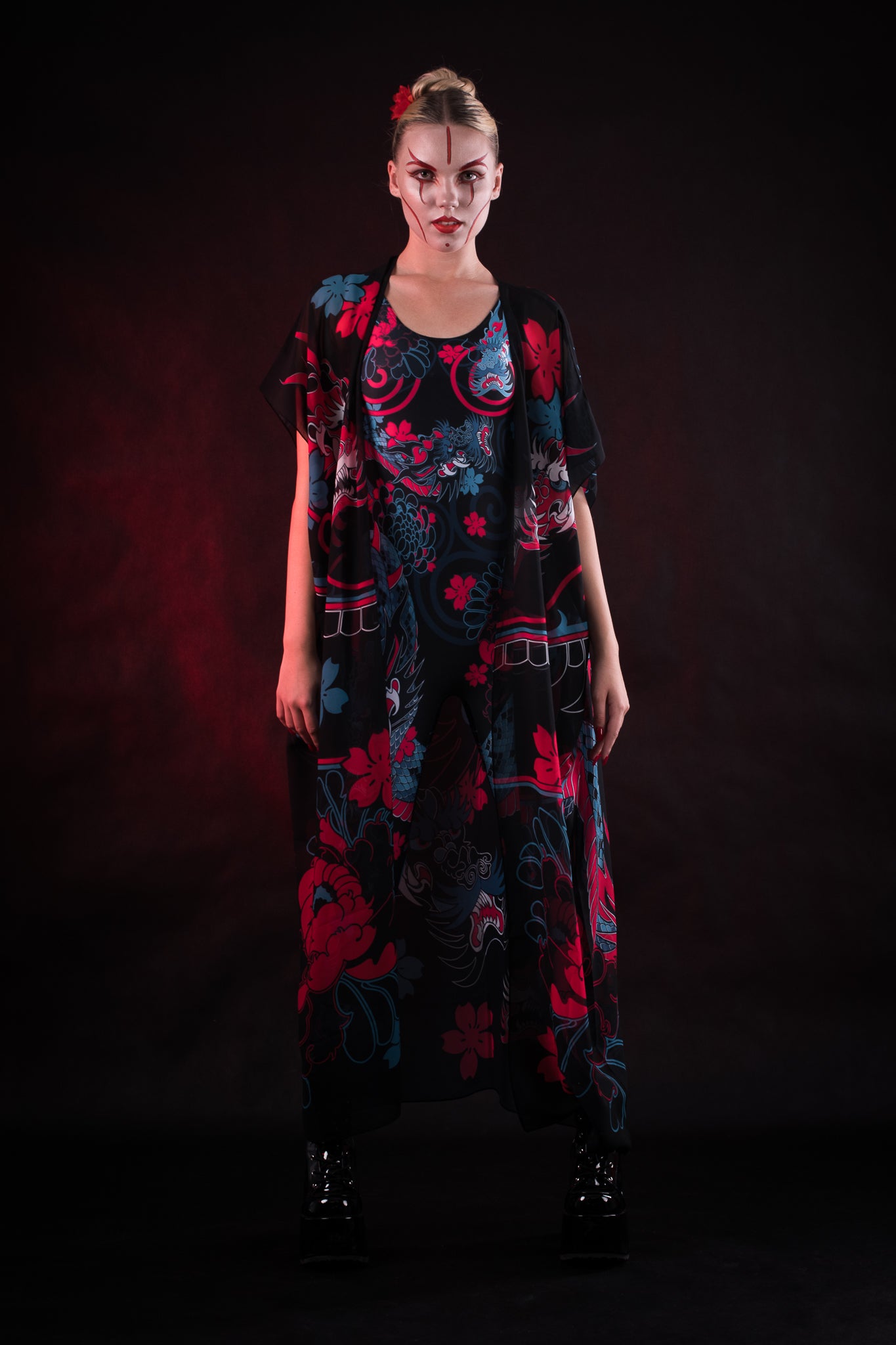 Woman posing in the Oriental Blossom Kimono, highlighting the intricate floral design and flowing fabric, great for Halloween or as a versatile fashion piece.