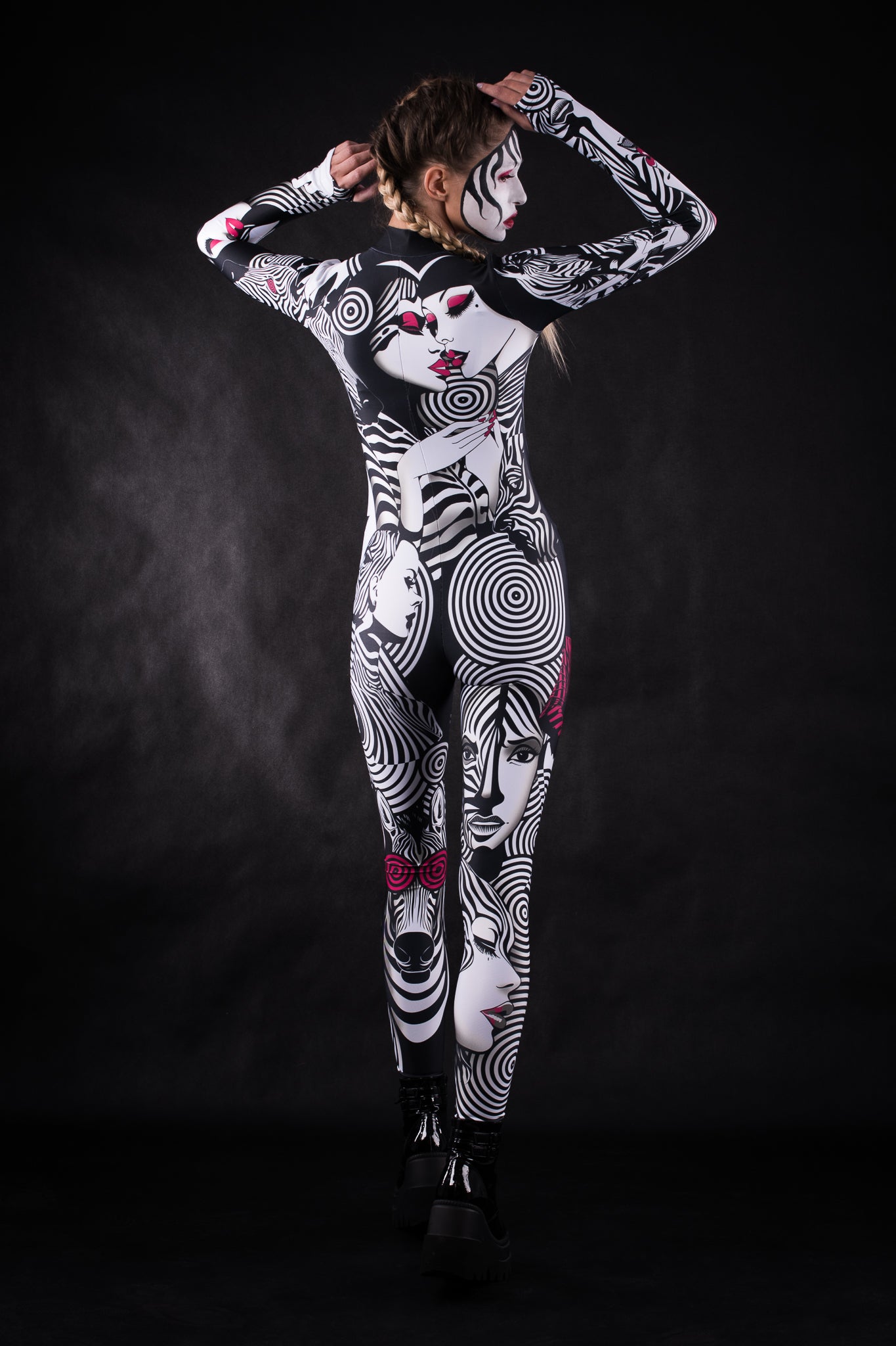 Woman posing in the White Zebra Femme Halloween costume, showcasing the bold black and white zebra design, great for Halloween, festivals, or as a stylish statement outfit.