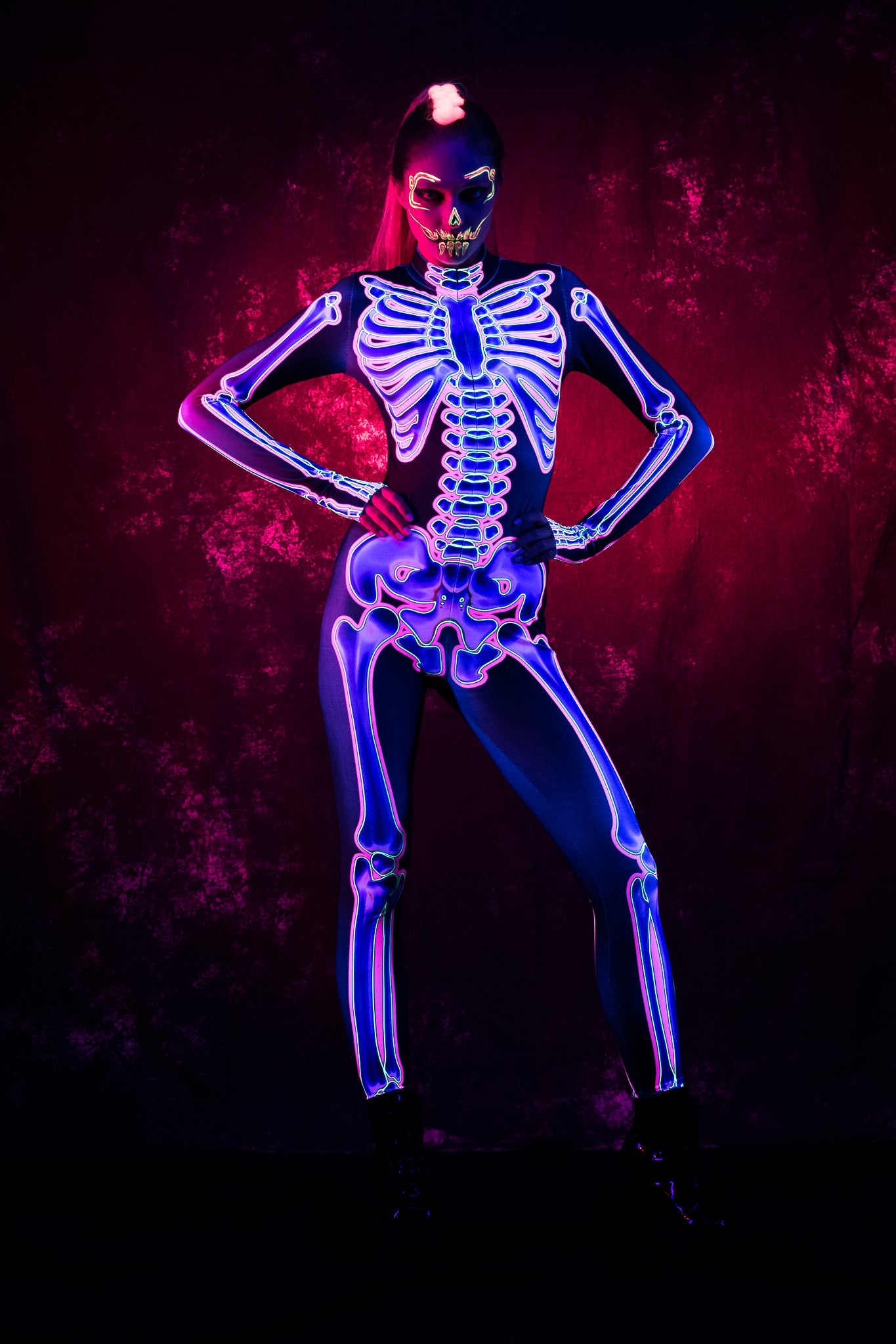 UV Reactive Skeleton Halloween costume for women, featuring a neon pink skeleton design, perfect for Halloween parties or UV-reactive festival outfits.