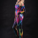 Side profile of a woman wearing Galaxy Explorer catsuit, showcasing the sleek silhouette and cosmic print details in this full body futuristic costume.