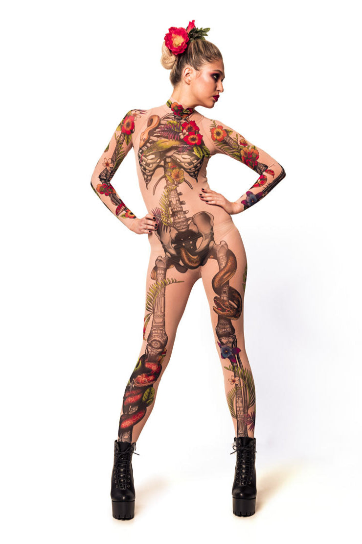 Front view of JUNGLE SNAKES Tattoo Skeleton Catsuit for Women – model with hands on hips and head tilted back, radiating fearless attitude.