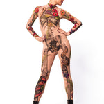 Front view of JUNGLE SNAKES Tattoo Skeleton Catsuit for Women – model with hands on hips and head tilted back, radiating fearless attitude.