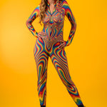 Model stands proudly in Rainbow Liquid Catsuit, embodying self-love, LGBTQ+ pride, and fierce festival energy.