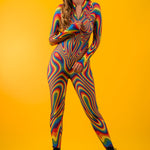 Model shows front zipper of Rainbow Liquid Catsuit, blending functionality with bold rainbow aesthetics perfect for queer festivals.