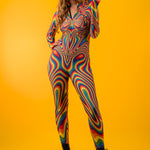 Front view of Rainbow Liquid Catsuit with model playing with hair, capturing joyful Pride vibes and colorful self-expression.