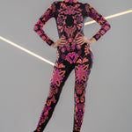 Front view of the SUNSET VOLTAGE UV Reactive Catsuit in natural light – vibrant multicolor pattern even without UV, ideal for festivals and party wear.