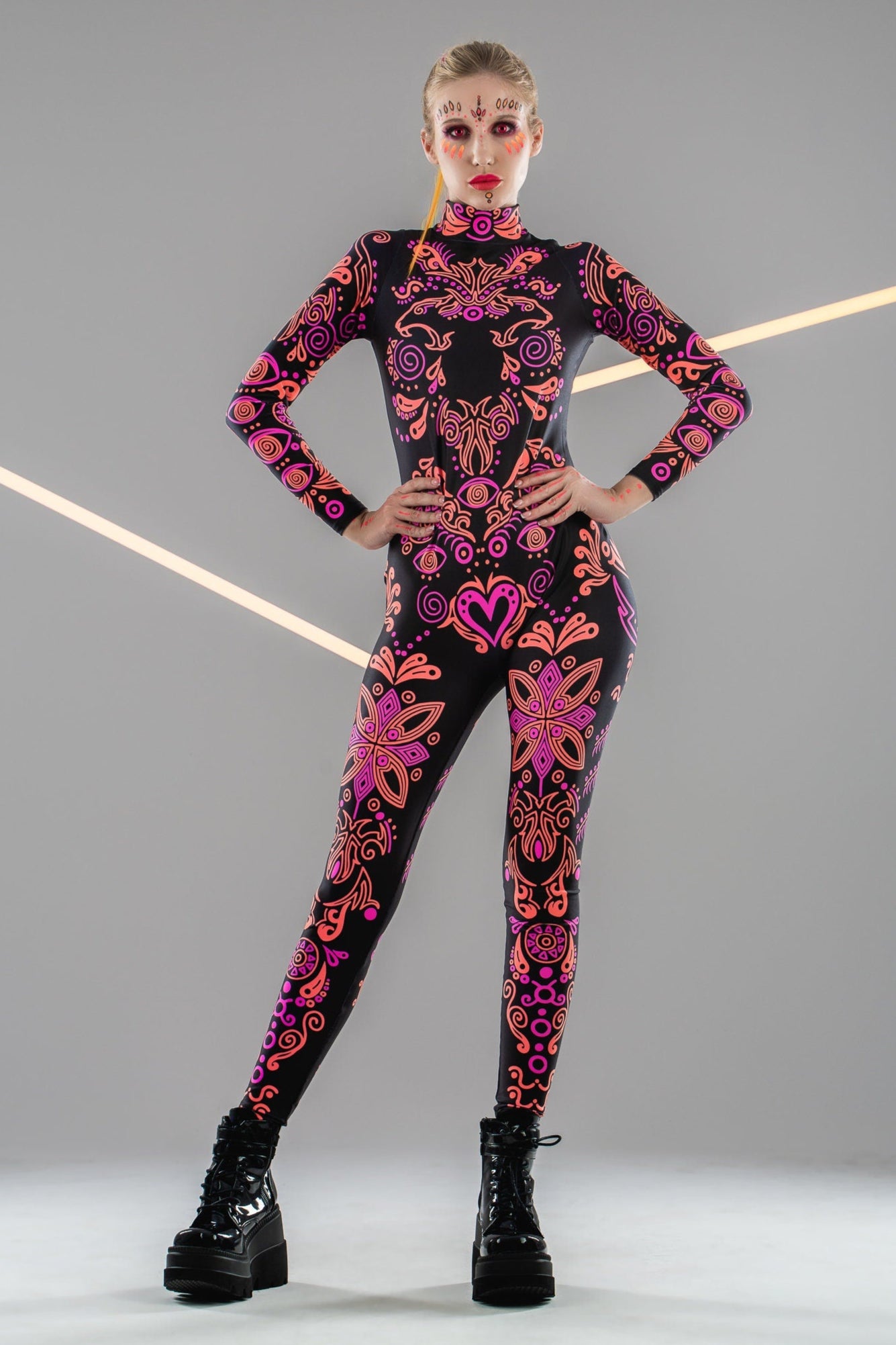 Front view of the SUNSET VOLTAGE UV Reactive Catsuit in natural light – vibrant multicolor pattern even without UV, ideal for festivals and party wear.