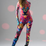 Dynamic front pose with leg forward in TRIPPY DREAM Catsuit, emphasizing bold colors and flexible, form-fitting design.