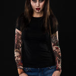 Zombie Halloween T-shirt for women with tattoo mesh sleeves, featuring horror-inspired zombie designs, perfect for Halloween or costume parties.