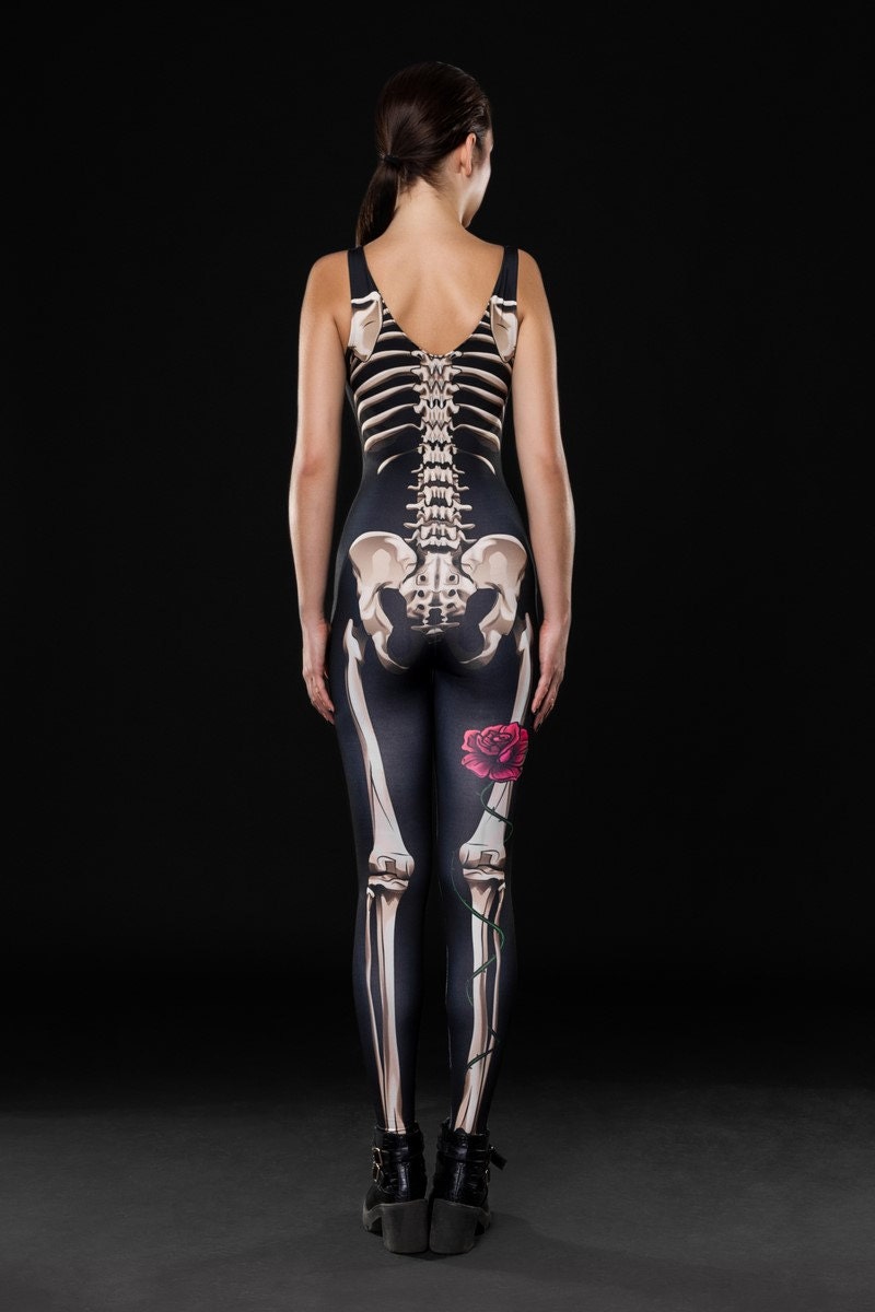 Woman posing in the Lady Death Halloween costume, highlighting the detailed skeleton design on a sleek black jumpsuit, great for Halloween parties or as a unique festival outfit.