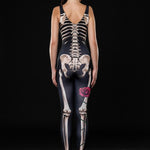 Woman posing in the Lady Death Halloween costume, highlighting the detailed skeleton design on a sleek black jumpsuit, great for Halloween parties or as a unique festival outfit.