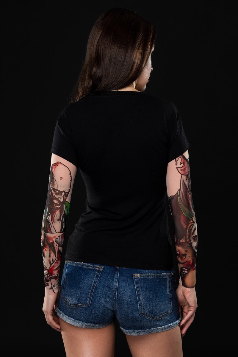 Close-up of the tattoo-style zombie designs on the mesh sleeves of the women's Halloween T-shirt, ideal for a spooky Halloween or casual costume look.