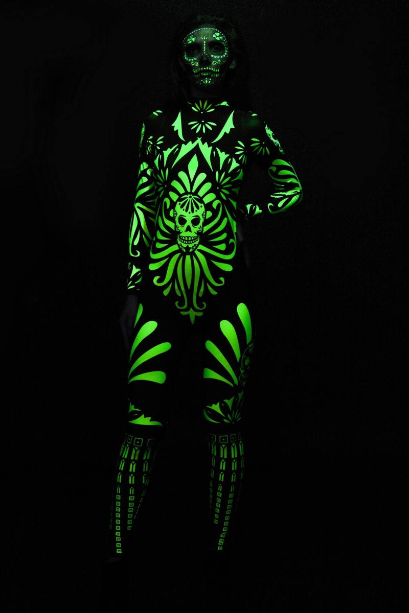 Fluo Mexican Skull Halloween costume for adults, featuring a fluorescent skull design on a full-body catsuit, perfect for Day of the Dead or Halloween parties.