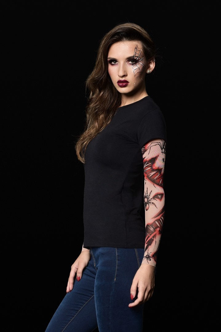 Close-up of the spiderweb tattoo sleeves on the women’s Halloween T-shirt, adding a bold Halloween touch to the design.