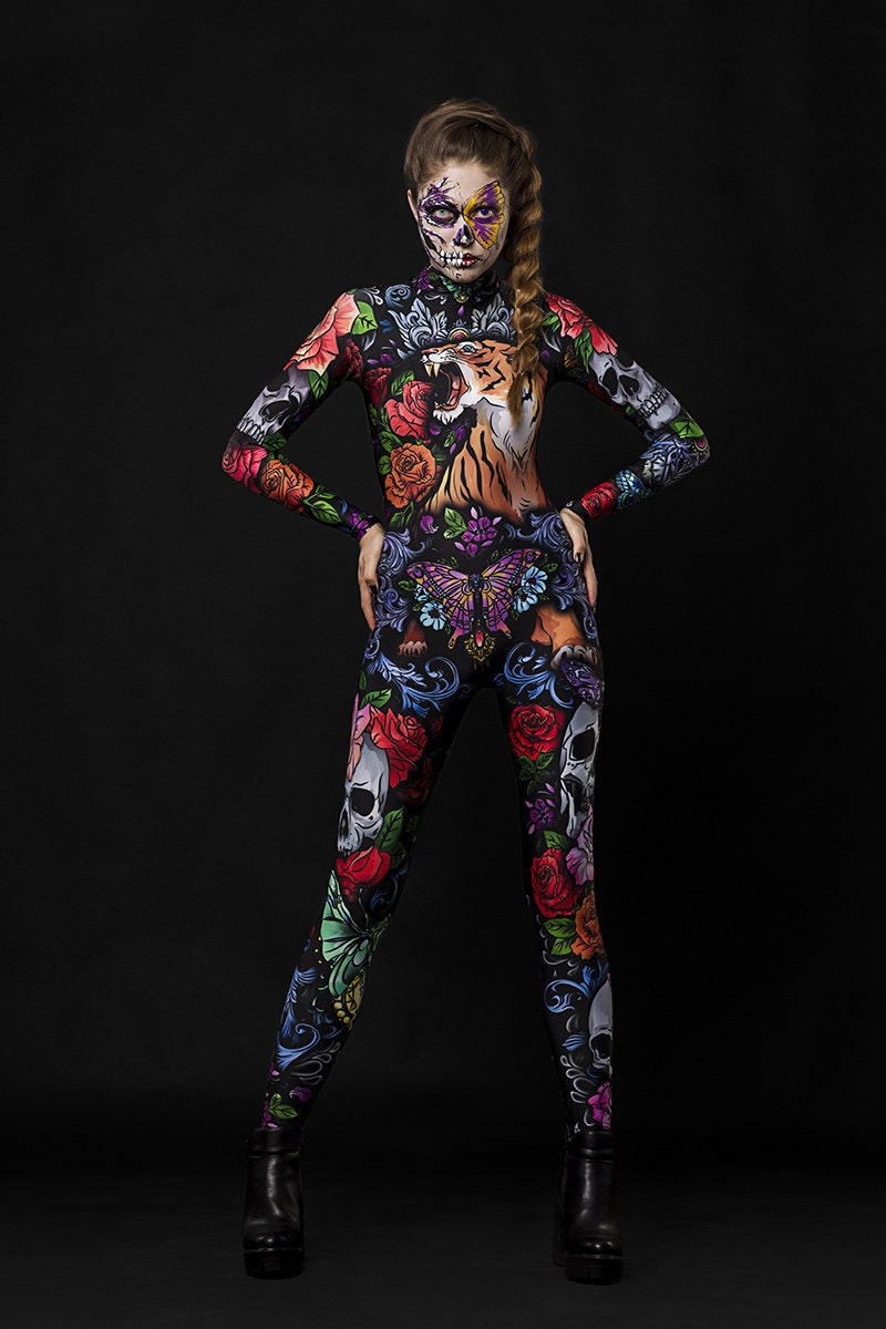 Tattoo Style Halloween costume for women, featuring a full-body catsuit with tiger, skull, and butterfly designs, perfect for Halloween parties or festival cosplay.