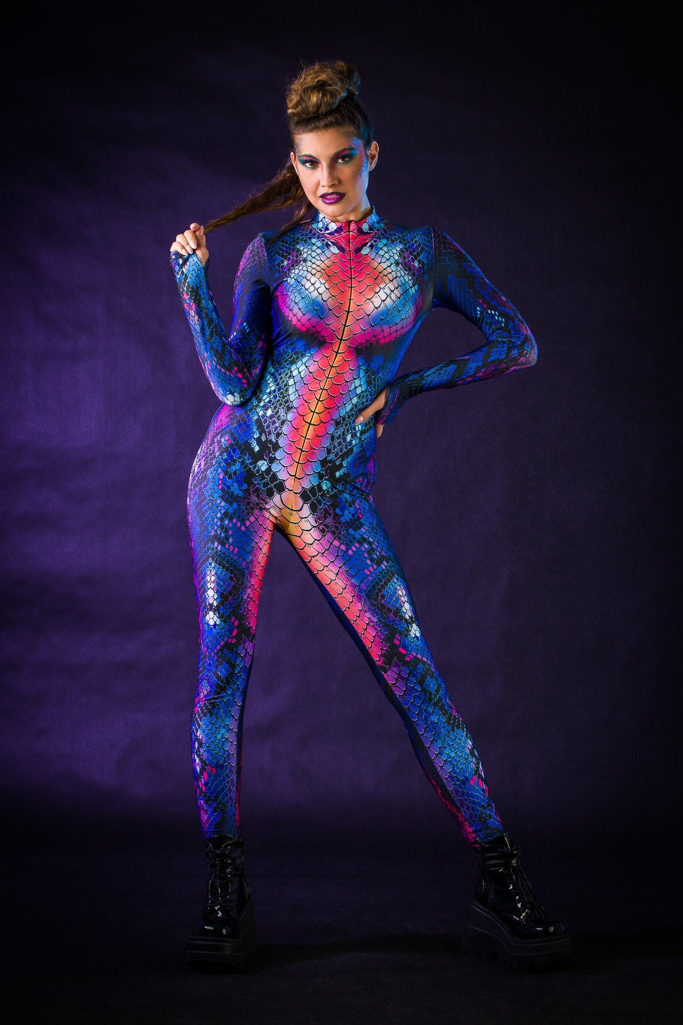 Blue Snake Halloween costume for women, featuring a snake skin jumpsuit with tattoo effect on the back, perfect for Halloween parties or music festivals.